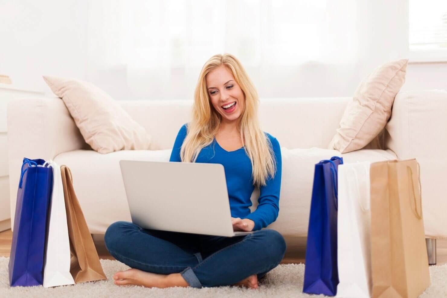 Happy woman shopping online. She enjoyed a postive user experience due to online shop support services that keep site up to date