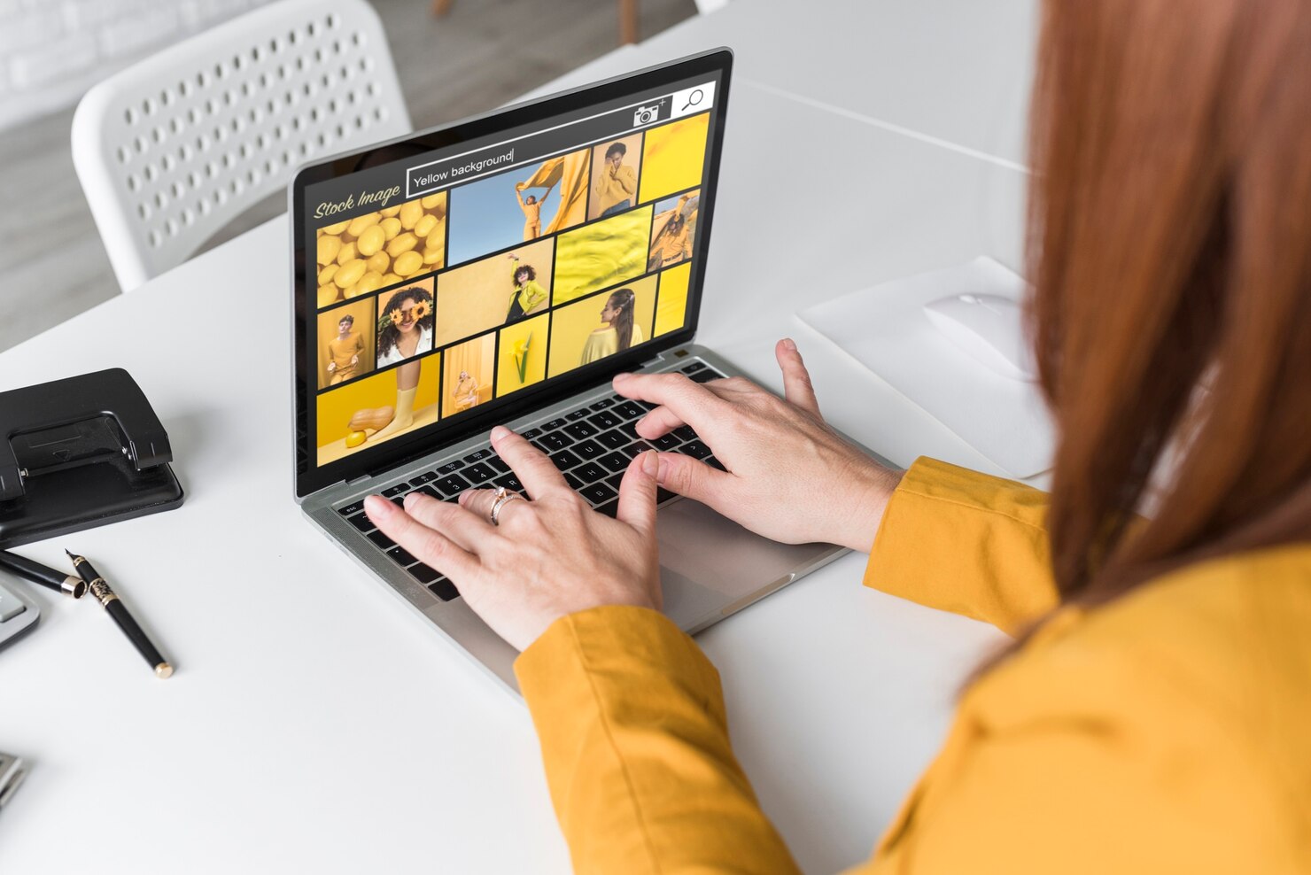 High quality images on a laptop screen. Woman looking at images on online shop