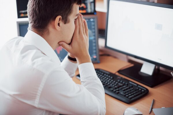 Young business man stressed out because he is struggling to prevent dowtime on site