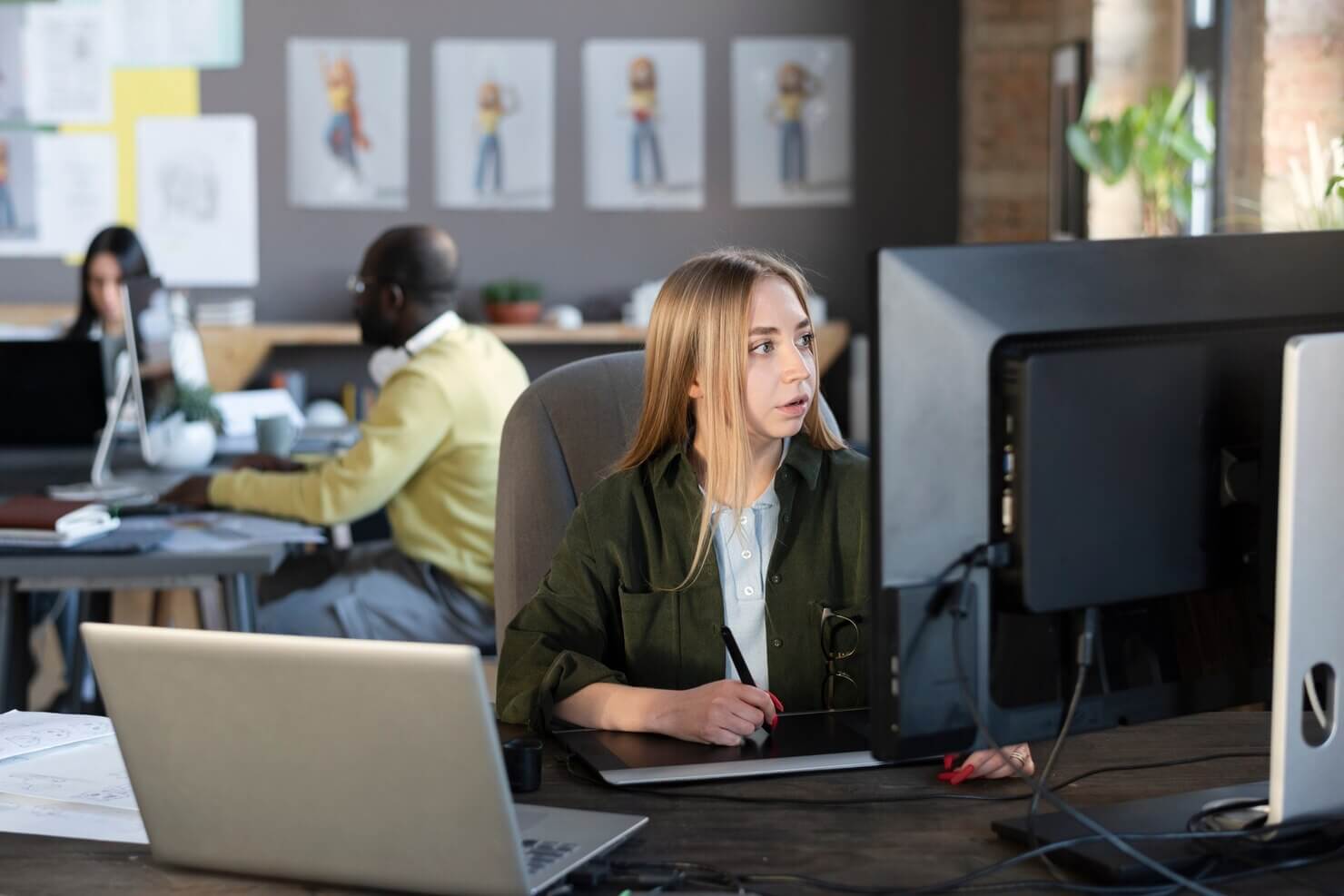 Young woman working in a design studio. WordPress Theme Customization with Figma