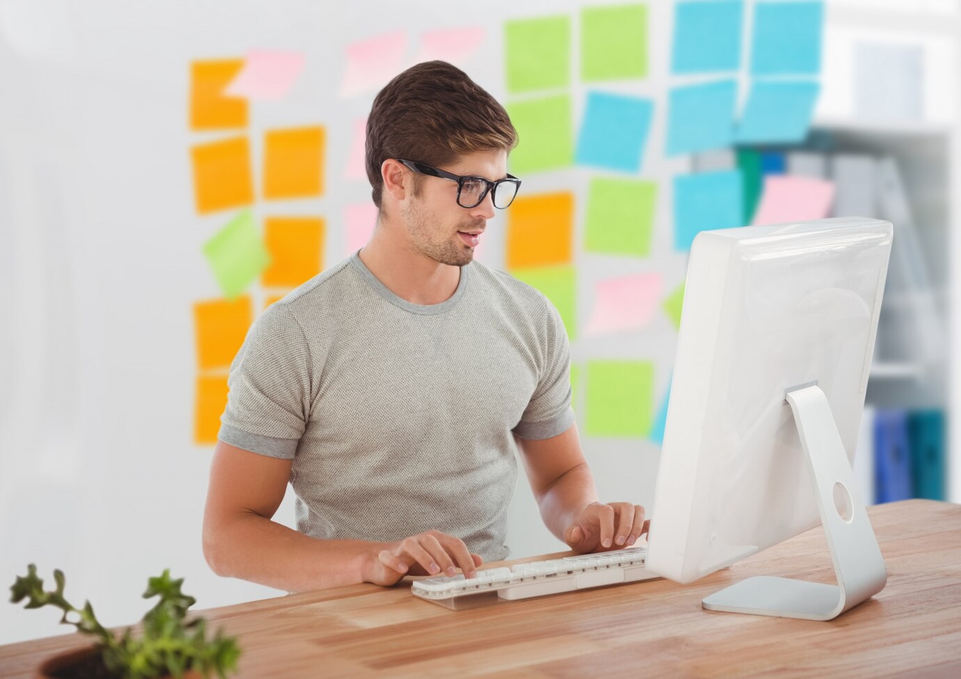 Man sitting working on web development with attention to SEO capabilities