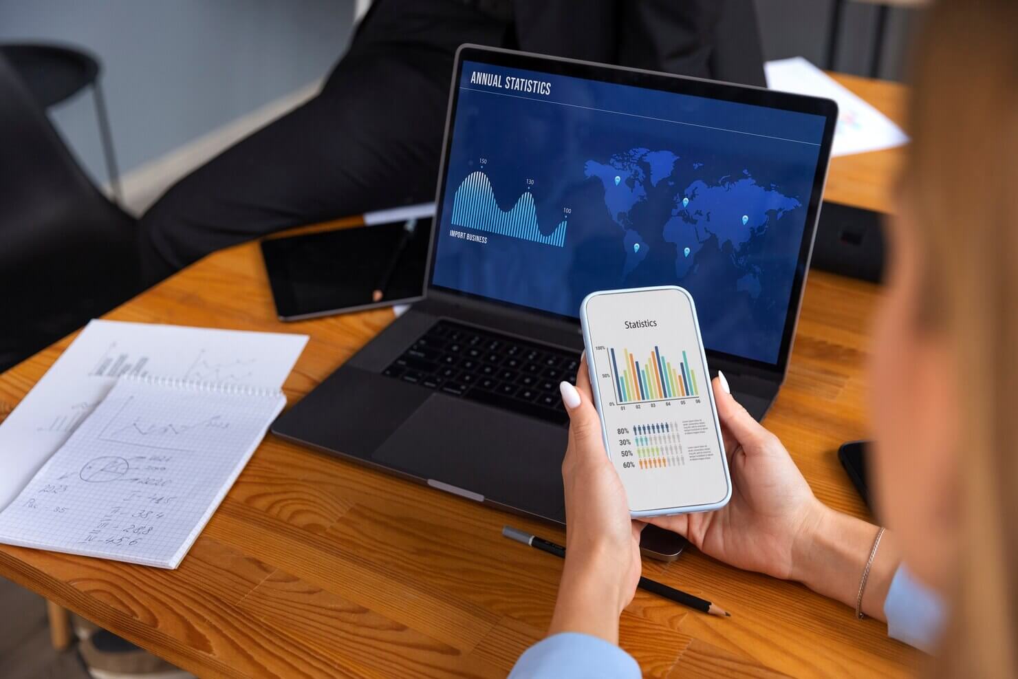 Business person looking at finance graphs. UX design in financial webistes on mobile devices