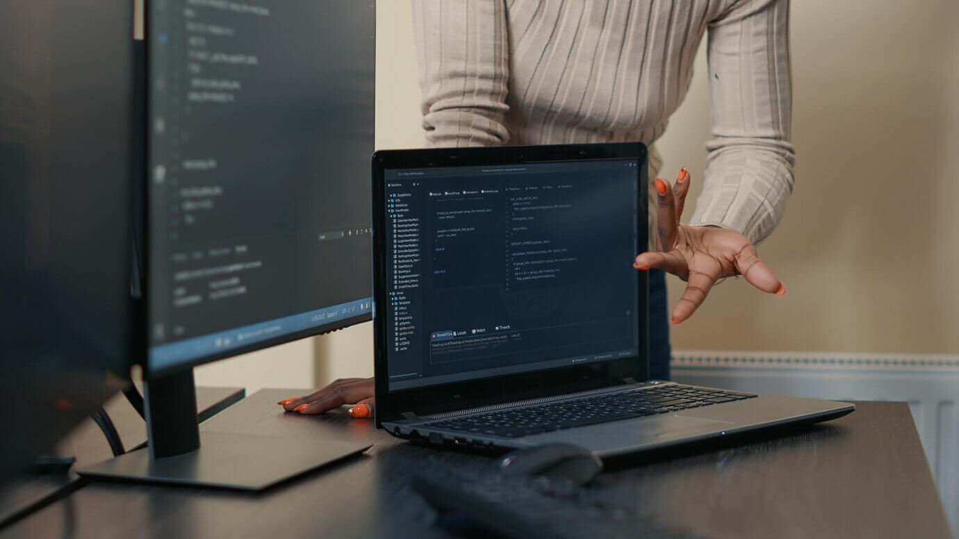 Laptop running code and updates, continuous monitoring of WordPress site