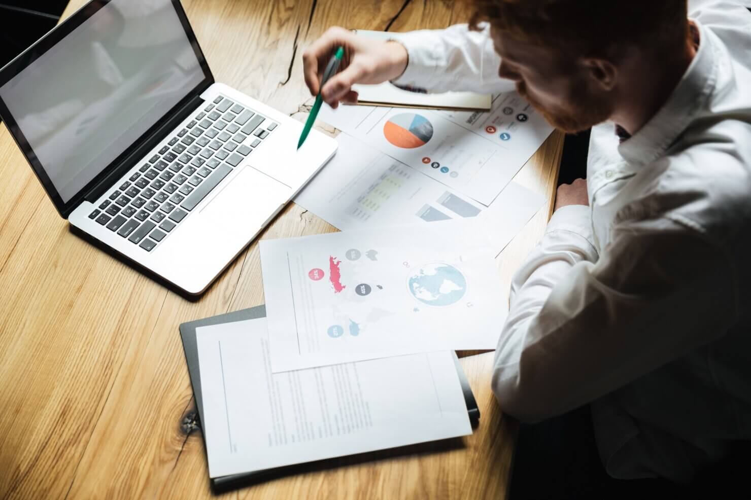 Business man analyzing the results of mobile usability report