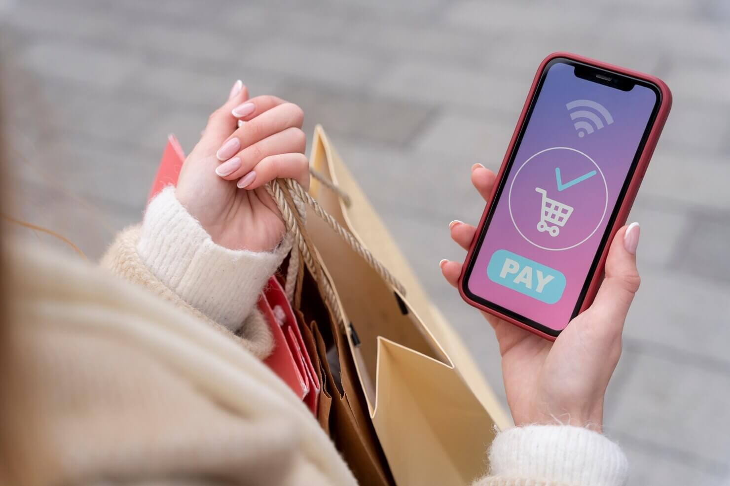 Young adult shopping in the city on your mobile phone. Responsive design on WooCommerce shop