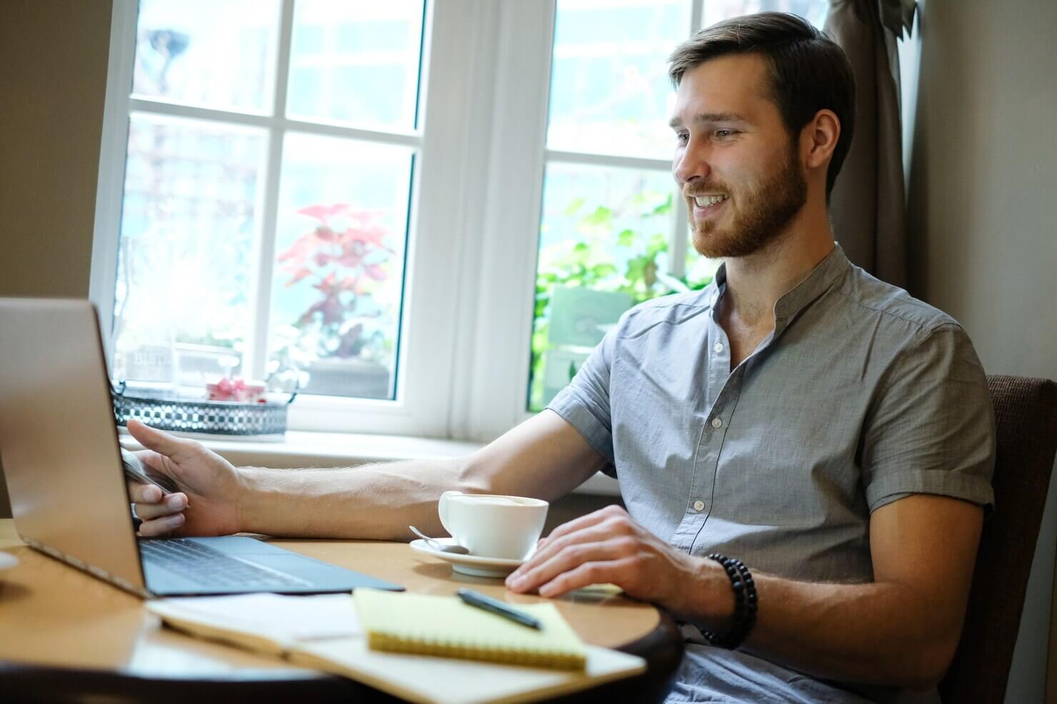 Man at work, writing a report about the difference between technical audits vs full website audits