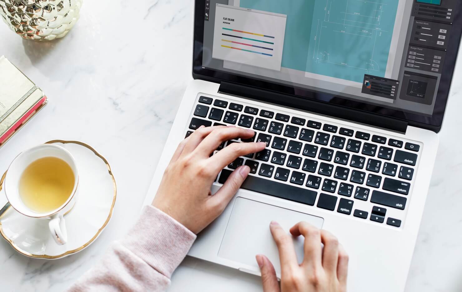 Person using laptop to build microinteractions in WordPress design