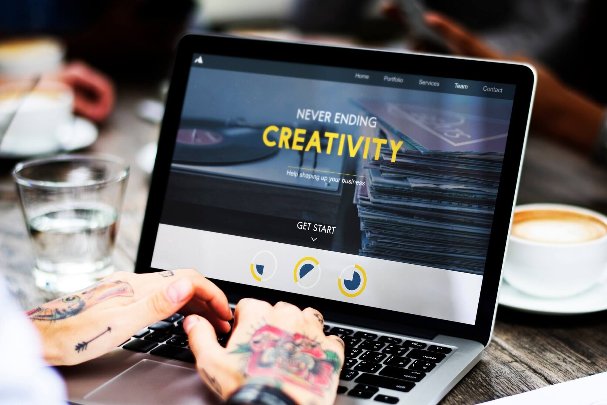 Woman Use Laptop at cafe to create a new website with a hamburger menu