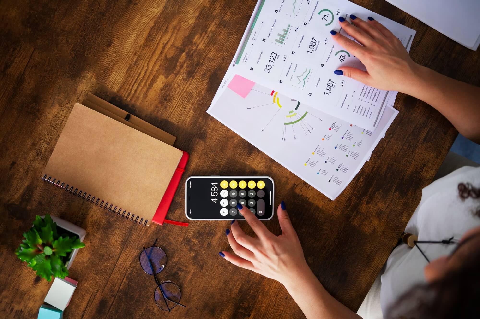 Woman-working-to-calculate-outsouring-costs-for-developing-software-